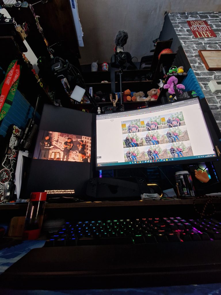 My computer corner with media equipment and theme park merchandise.